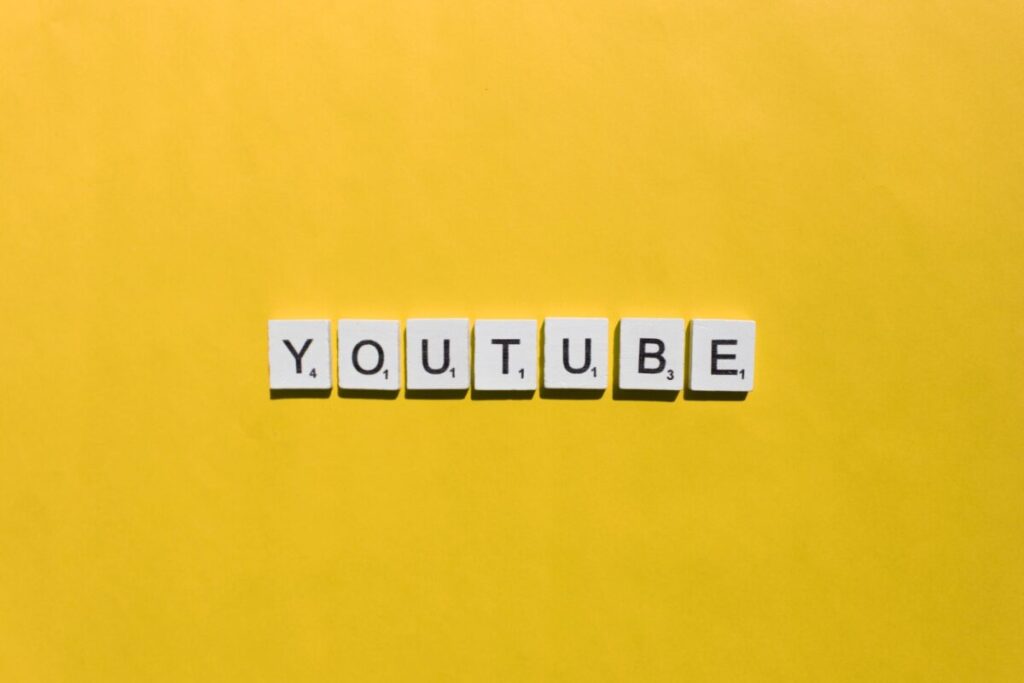 YouTube scrabble letters word on a yellow background